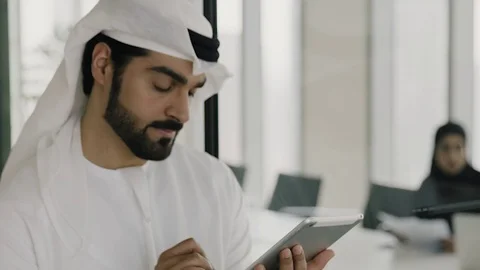 Arab man working on a tablet. Stock Footage 126310680