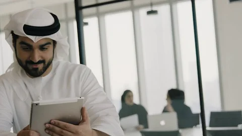 Arab man working on a tablet. Stock Footage 126310692