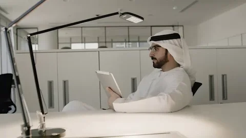 Arab man working on a tablet. Stock Footage 126310701