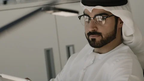 Arab man working on a tablet. Stock Footage 126310710
