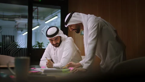 Arab men discussing architectural plans. Stock-Footage 237259758