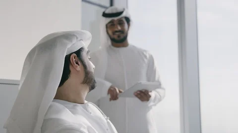 Arab men discussing in an office. Stock Footage 125839693