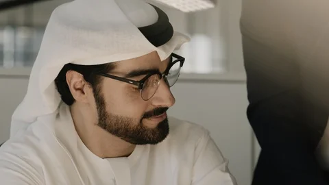 Arab men discussing in an office. Stock Footage 125860636