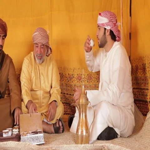 Arab men drinking gawa inside a tent. Stock Footage 69486061