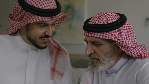 Arab men looking at mobile. Stock Footage 88098521