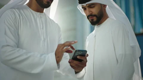 Arab men looking at a mobile. Stock Footage 237267886