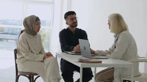 Arab Middle Eastern couple discussing infertility problems with female doctor Stock Footage 292155944