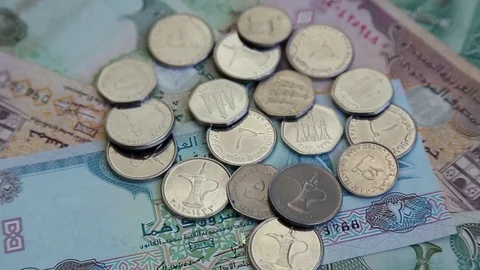 Arab money UAE dirhams on rotating surface background 스톡 동영상 70047379