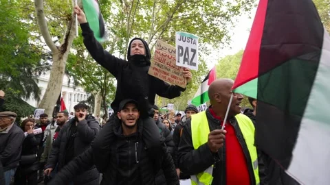 Arab people marching and shouting against genocide during Pro-Palestine march 스톡 동영상 254366812