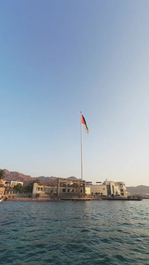 Arab Revolt Flagpole in Aqaba, Jordan on the Red Sea coast vertical video reel Stock Footage 333126451