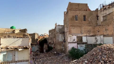 Arab Spring damaged buildings destroyed city towns abandoned sad houses Stock Footage 296496712