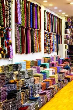 Arab store selling a variety of fabrics, Fabric in rolls Stock-Fotos