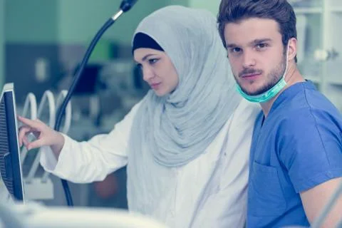 Arab students with hijab while working on the denture, false teeth. Stock Photos