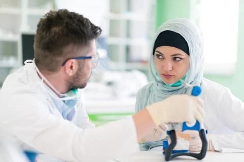 Arab students with hijab while working on the denture, false teeth. 写真素材