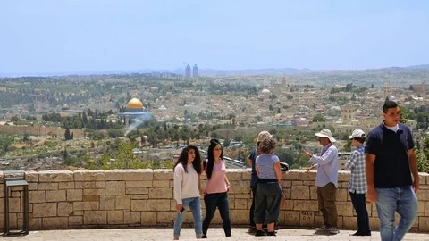 Arab tourists look at the Jerusalem Old City view Stock Footage