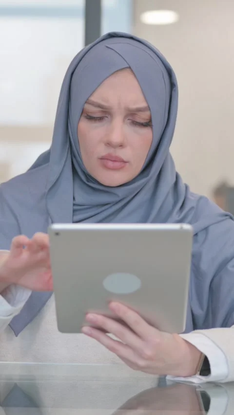 Arab Woman Feeling Upset while Using Tablet, vertical video Video stock 324713359
