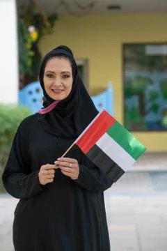 Arab woman smiling with UAE National Flag Stock Photos
