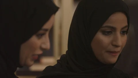 Arab women using a laptop at a cafe. Stock Footage 105805477