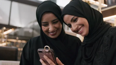 Arab women using a smartphone Stock Footage 105804366