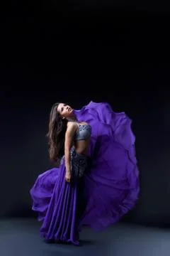 Arabia dancer posing with flying fabric Stock Photos
