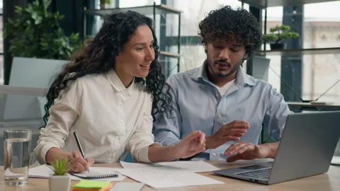 Arabian female employer insurance agent consult Indian male client discuss Stock Footage 250237607