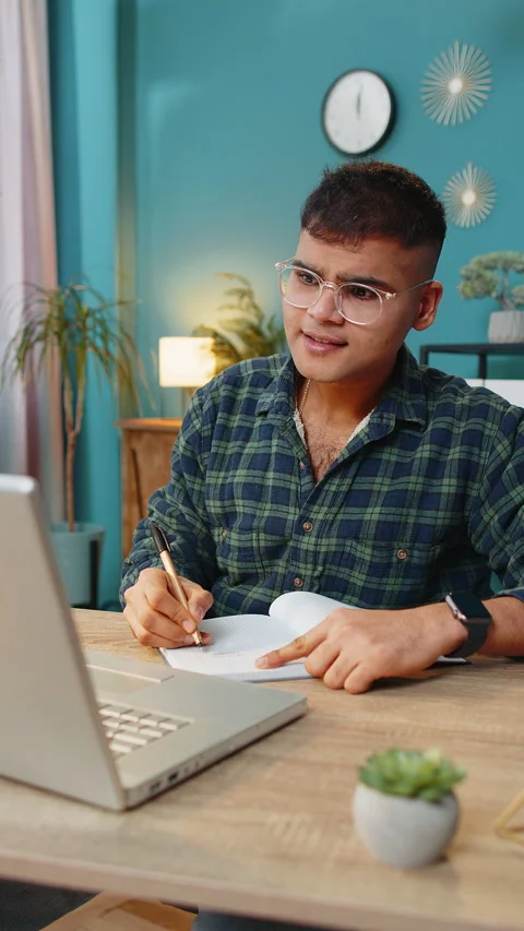 Arabian man student study at home on laptop computer making conference video Stock Footage 296131560