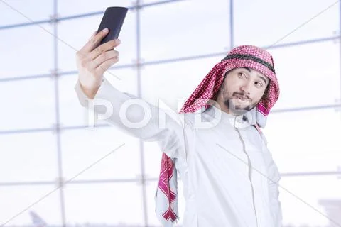 Arabian Man Taking Picture Of Himself