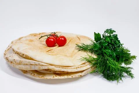 Arabic bread with dill on white background Foto stock
