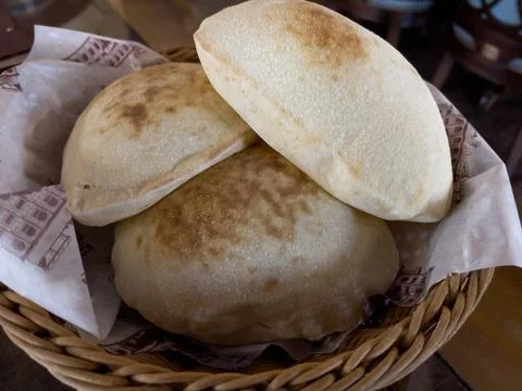 Arabic bread served in a basket Stock Photos