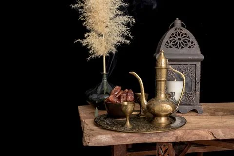 Arabic coffee and dates set up. black background. Stock Photos