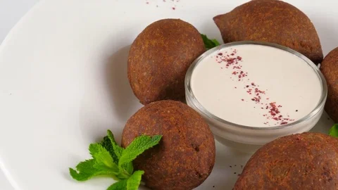 Arabic cuisine, meat appetizer kibbeh, minced meat and bulghur wheat Stock Footage 78527720