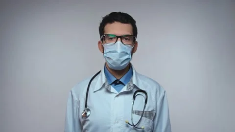 Arabic doctor face looking to camera and nodding. Bald male doctor shaking head Stock Footage 155619200