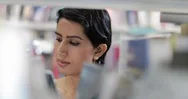 Arabic Female Student Choosing Book In Library Stock Footage