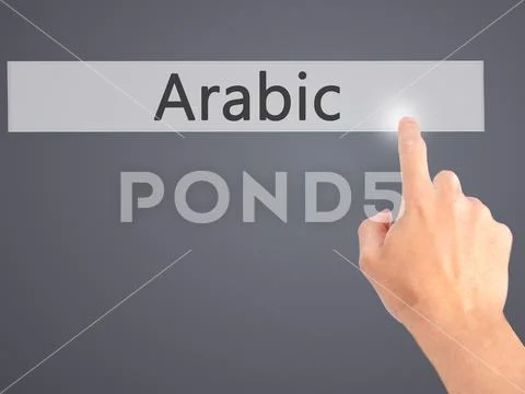 Arabic - Hand pressing a button on blurred background concept on Stock Photos