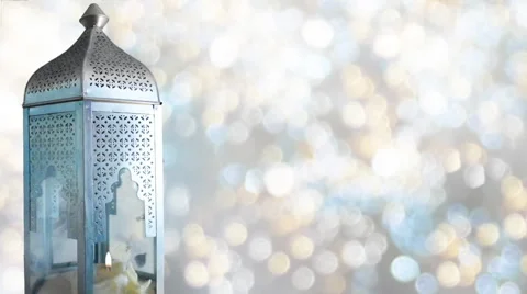 Arabic lantern with burning candle and glittering bokeh lights, loopable Video stock 61456514