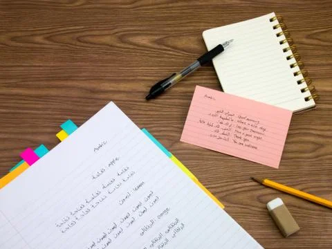 Arabic; Learning New Language Writing Words on the Notebook Stock Photos