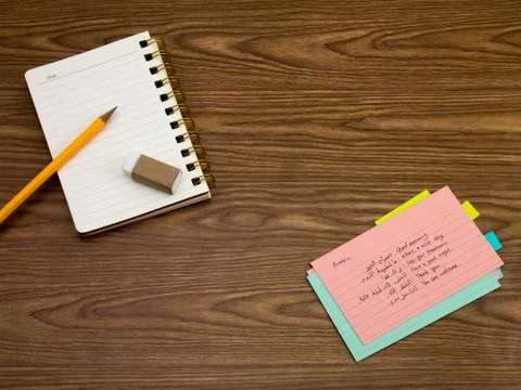 Arabic; Learning New Language Writing Words on the Notebook Stock Photos