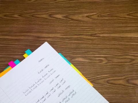 Arabic; Learning New Language Writing Words on the Notebook Stock Photos