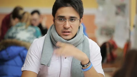 Arabic man actively discusses working details with his colleague Stock Footage 66518042