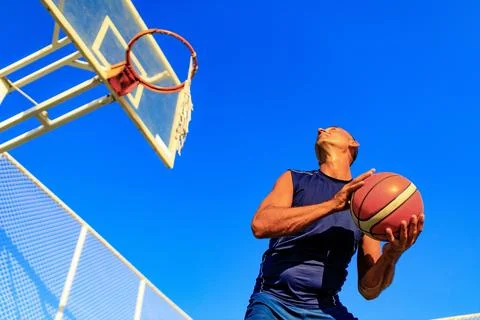 Arabic man athlete man playing basketball outdoors Stock Photos