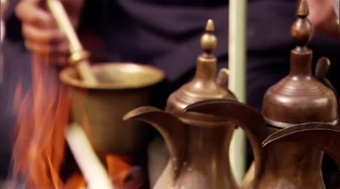 An arabic man cooks over a camp fire. Stock Footage 46868802