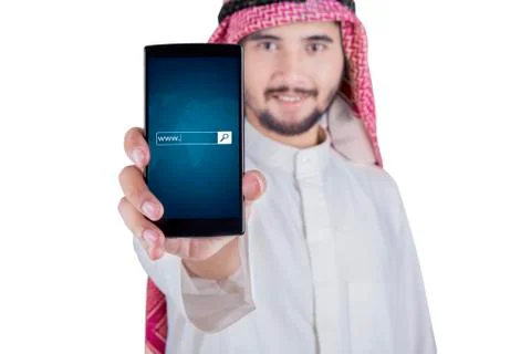 Arabic man displaying www text on cellphone Fotos Stock