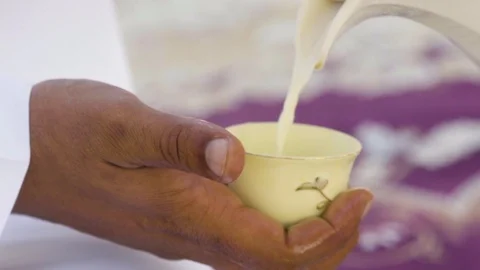 Arabic Man is Serving Camel Milk Tea Stock Footage 121206679