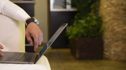 Arabic man working on laptop and mobile Stock Footage 73518190