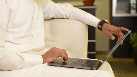 Arabic man working on laptop and mobile Stock Footage 73518326