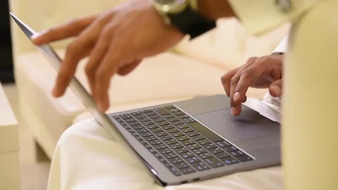 Arabic man working on laptop and mobile Stock Footage 73518333