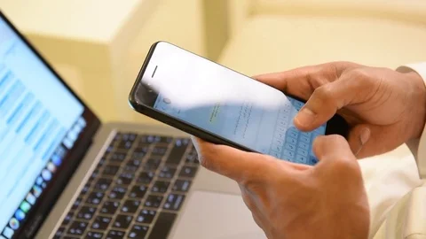 Arabic man working on laptop and mobile Stock Footage 73518511