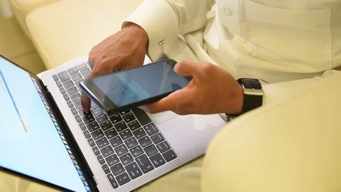 Arabic man working on laptop and mobile Stock Footage 73518857
