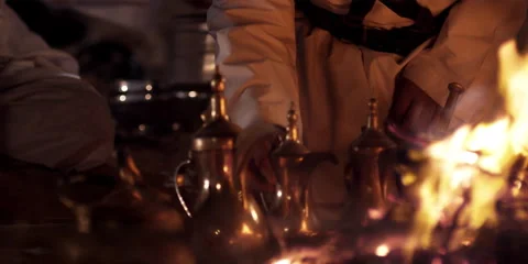 Arabic men cooking at a camp fire. Stock Footage 46870655