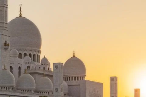Arabic mosque facade with domes, with sunset light. Great Mosque. UAE. Abu dh Stock Photos